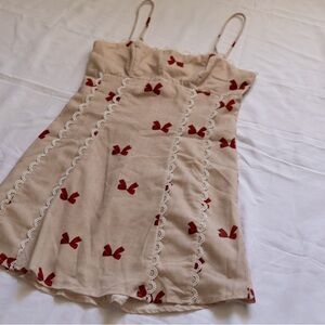 Selfie Leslie Beige Mini Dress with Red Bow Print